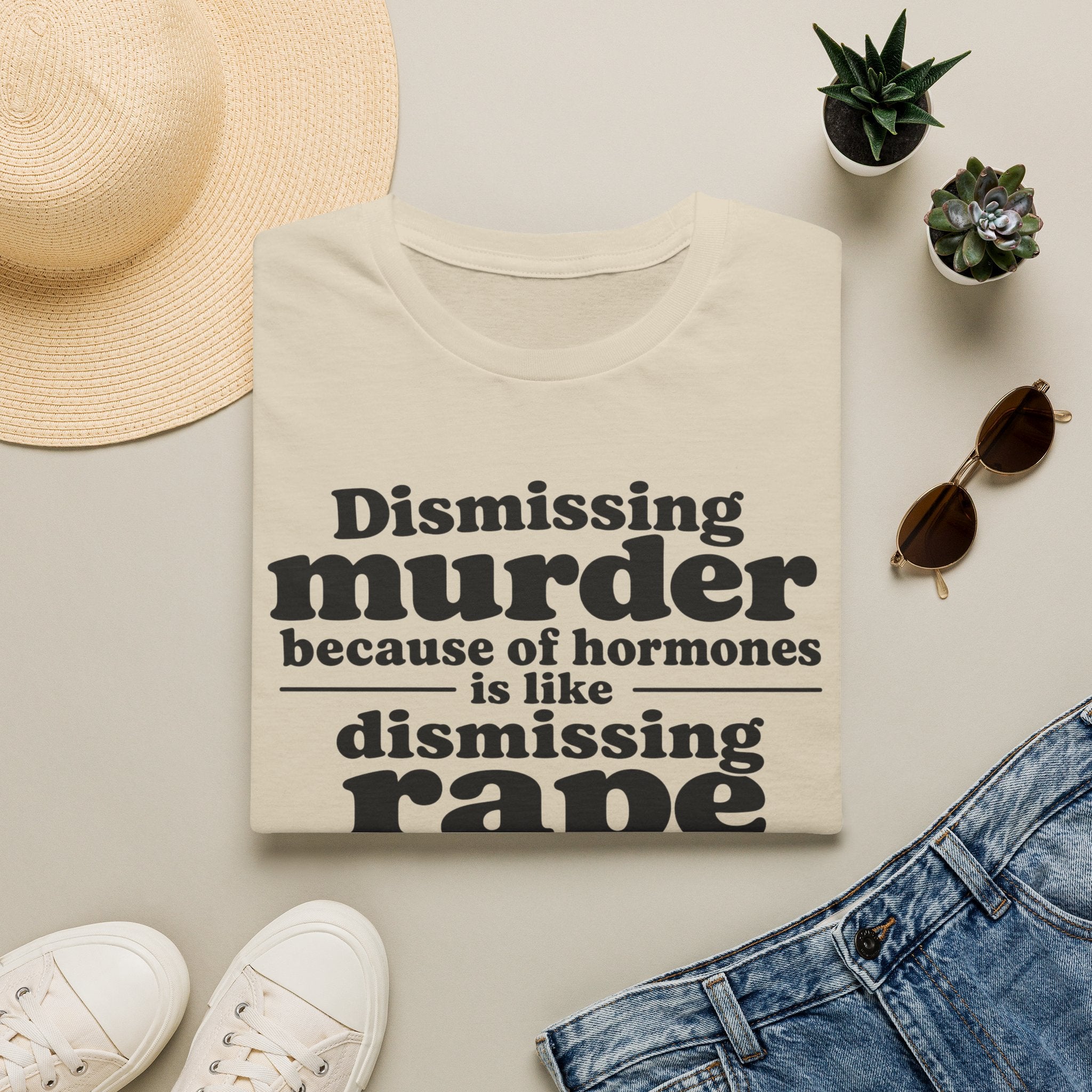Statement Tee — "Dismissing m because of hormones is like dismissing r because of testosterone"