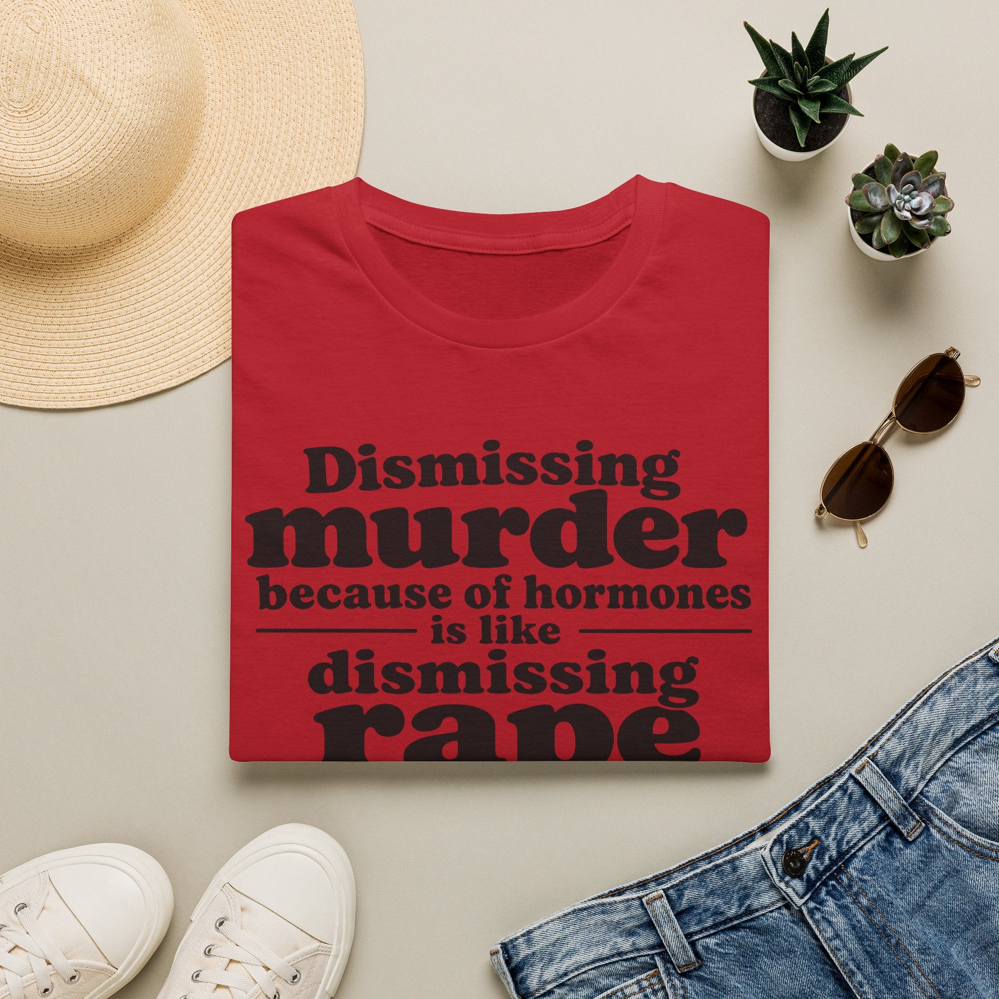 Statement Tee — "Dismissing m because of hormones is like dismissing r because of testosterone"