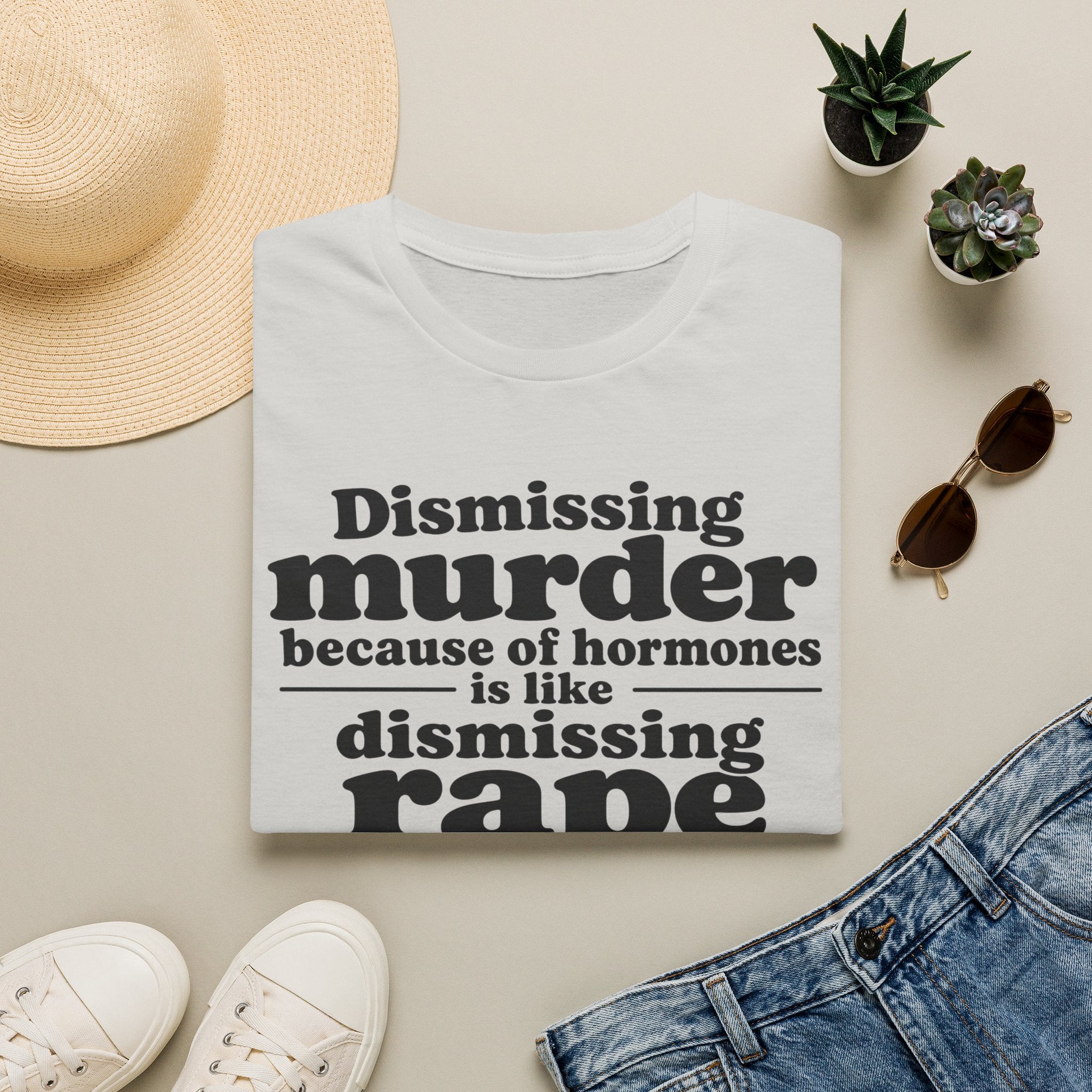 Statement Tee — "Dismissing m because of hormones is like dismissing r because of testosterone"