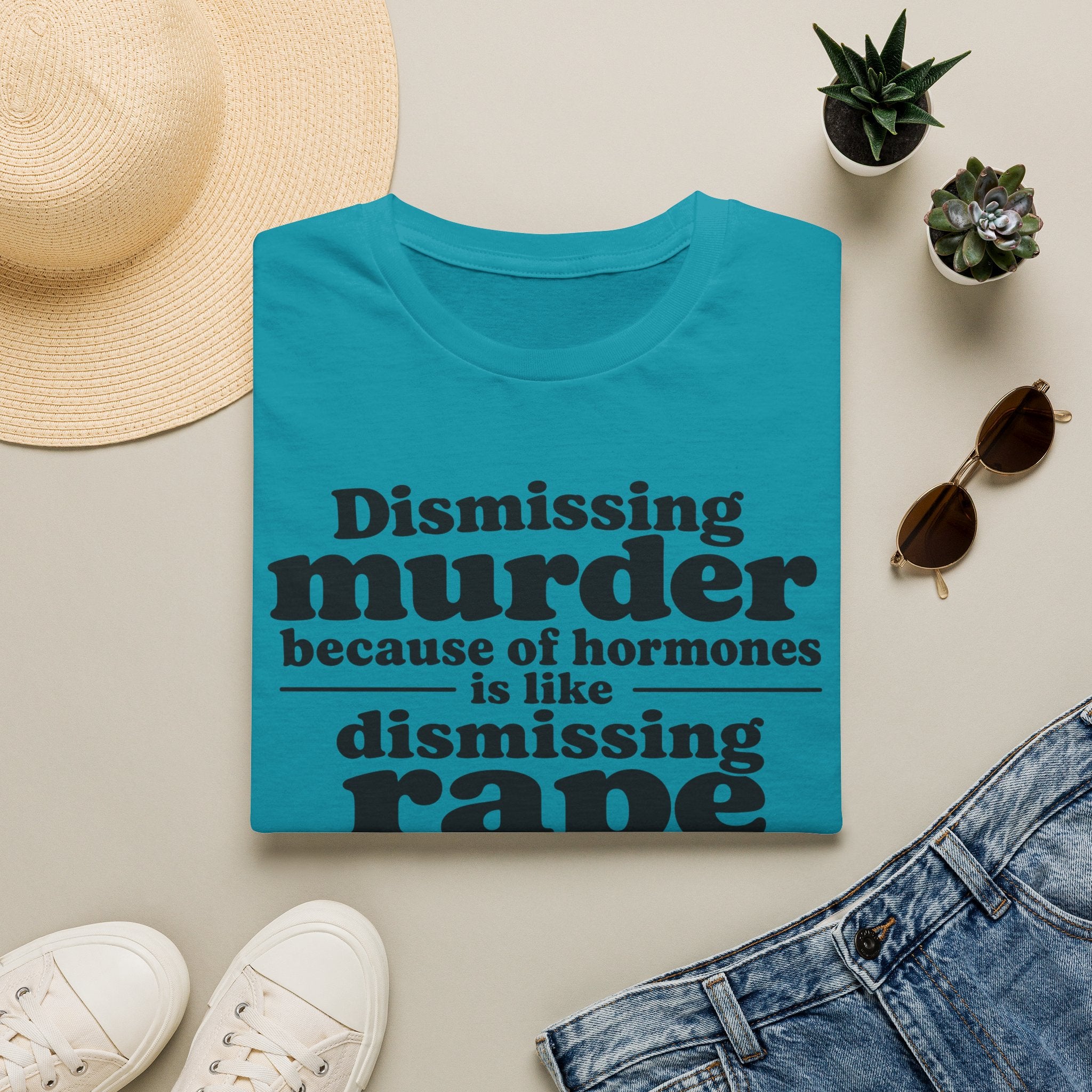Statement Tee — "Dismissing m because of hormones is like dismissing r because of testosterone"